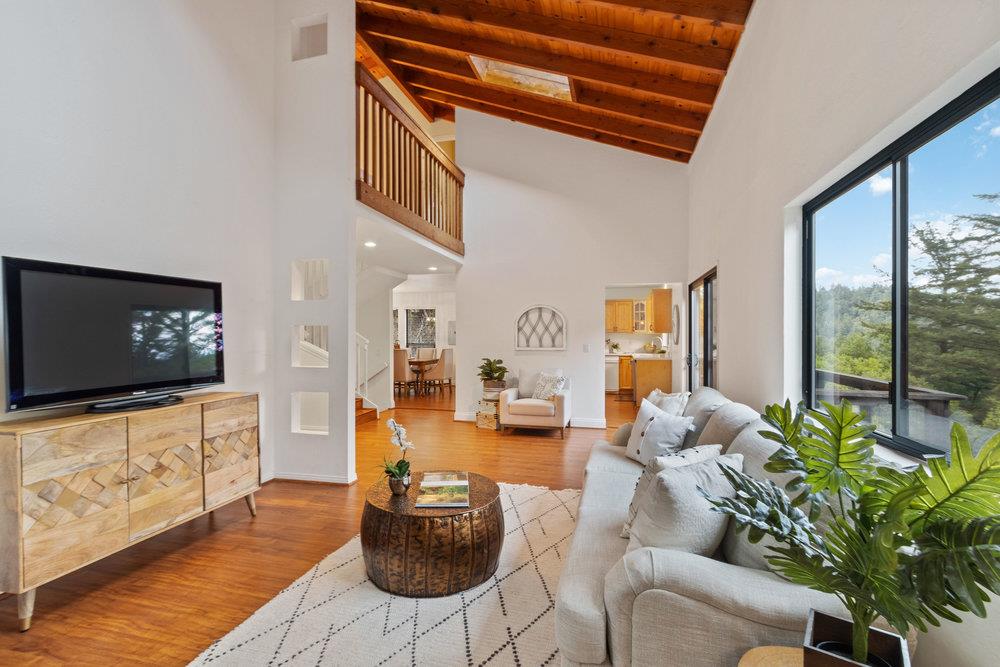 22101 Miller Ridge Road Los Gatos, CA 95033 - Photo 10 of 76 a living room with furniture and a flat screen tv