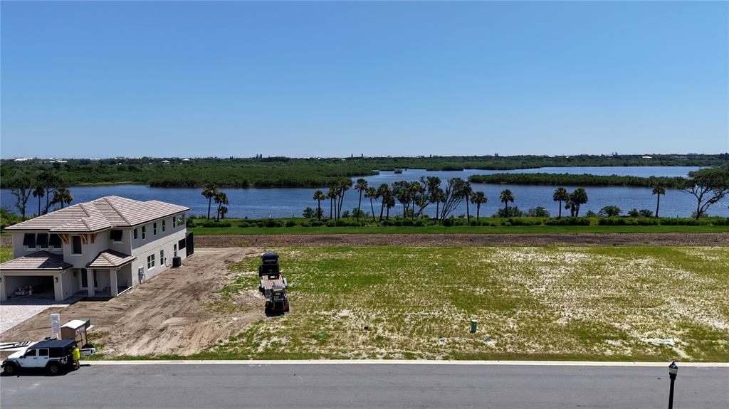 20 Coronado Road Flagler Beach, FL 32136 - Photo 15 of 15 a aerial view of a house with swimming pool garden view and lake view