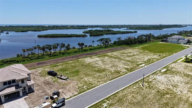 a view of a lake with a outdoor seating
