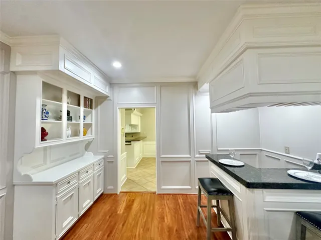 a kitchen with a sink and wooden cabinets