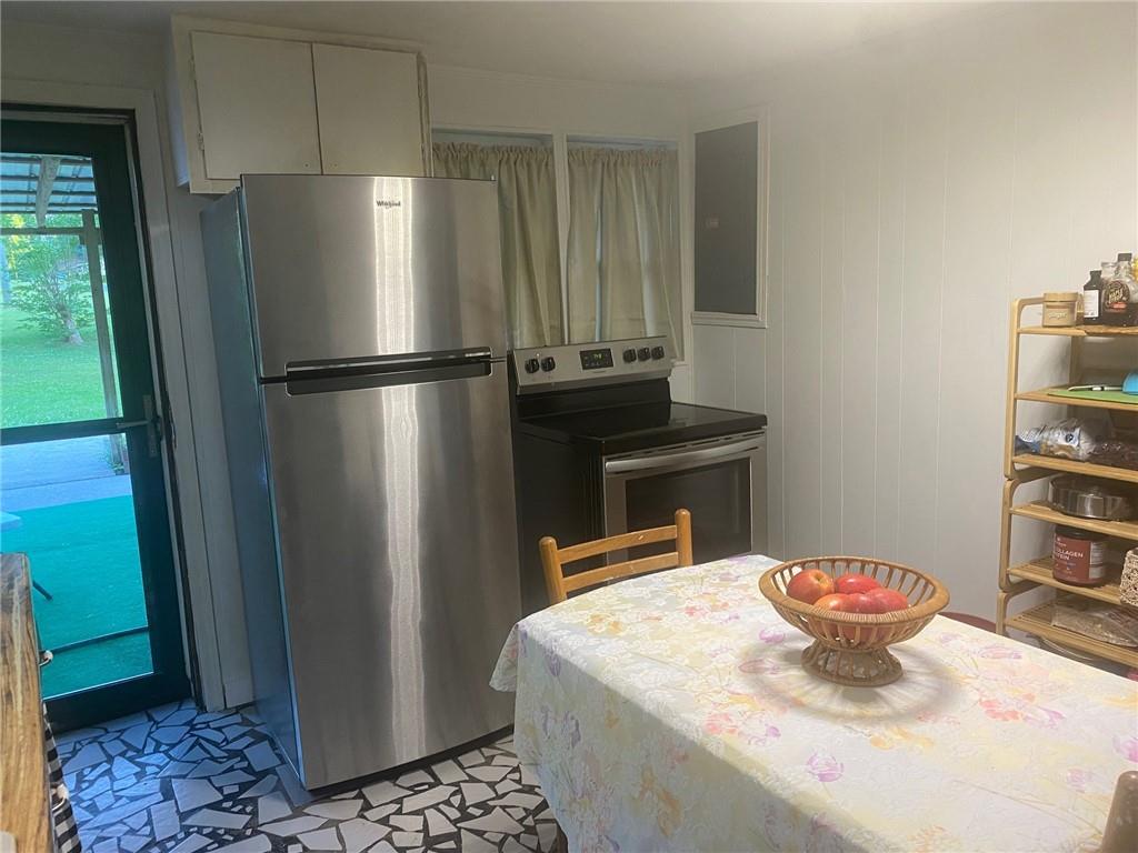1525 Sloppy Floyd Lake Road Summerville, GA 30747 - Photo 3 of 17 a kitchen with stainless steel appliances granite countertop a refrigerator a stove and a sink