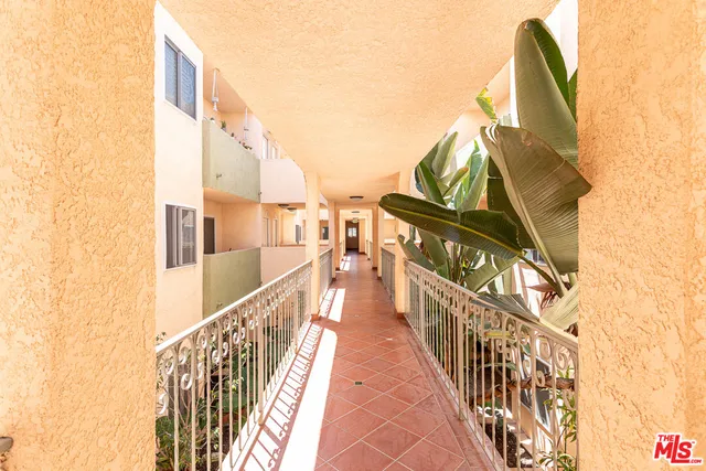 a view of a balcony with wooden floor