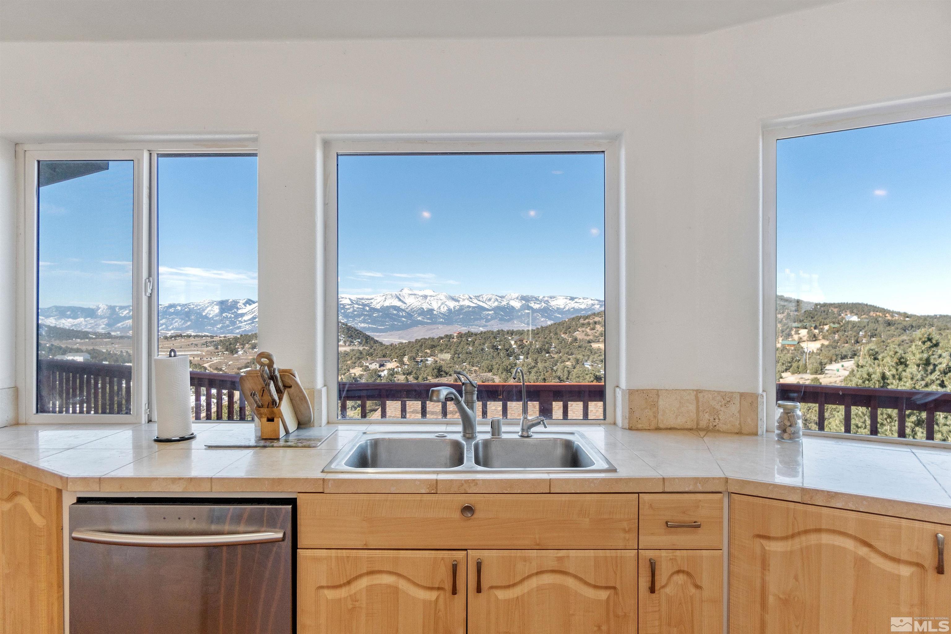 21435 Saddleback Road Reno, NV 89521 - Photo 8 of 29 a kitchen with a sink and large window