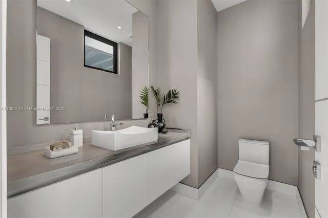 a view of an entryway with wooden floor and windows