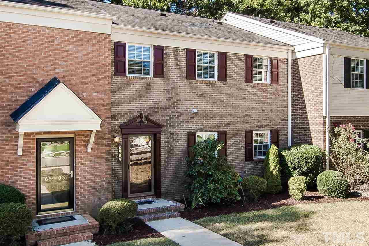 6505 New Market Way, Unit 6505 Raleigh, NC 27615 - Photo 3 of 25 a front view of a house with plants