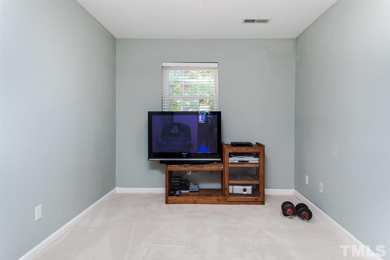 6505 New Market Way, Unit 6505 Raleigh, NC 27615 - Photo 22 of 25 a room with furniture and dresser
