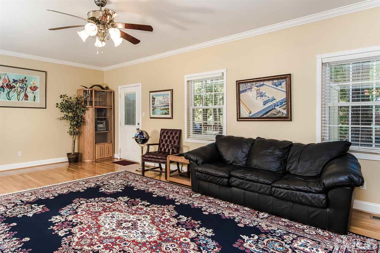6505 New Market Way, Unit 6505 Raleigh, NC 27615 - Photo 8 of 25 a living room with furniture and a window