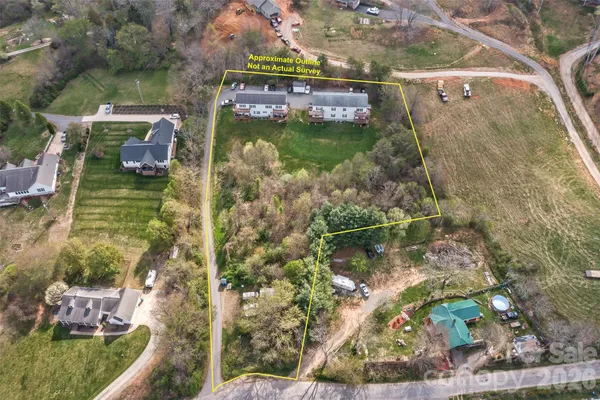 view of a swimming pool with a yard
