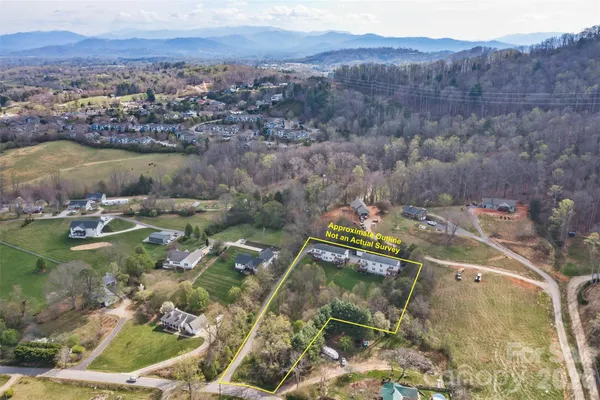 an aerial view of residential house with outdoor space and river