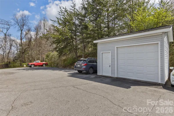 a view of a car parked in front of a house