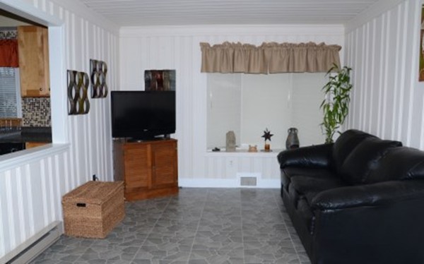 91 Jeffrey Road Springfield, MA 01119 - Photo 11 of 30 a living room with furniture and a flat screen tv