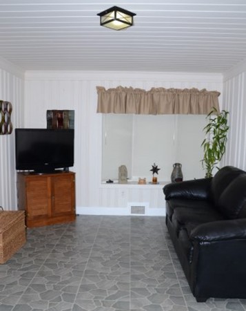 91 Jeffrey Road Springfield, MA 01119 - Photo 13 of 30 a living room with furniture and a flat screen tv