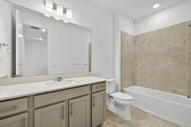 a bathroom with a sink a toilet and a bathtub