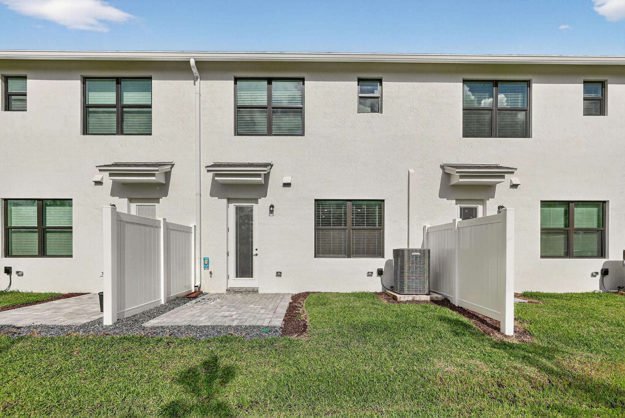 7596 Southwest Linus Lane Stuart, FL 34997 - Photo 19 of 26 a backyard of a house with lots of green space