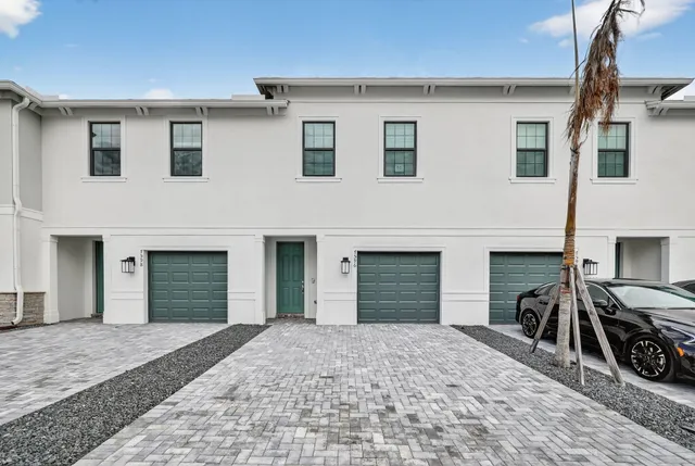 a view of a house with windows and a fireplace