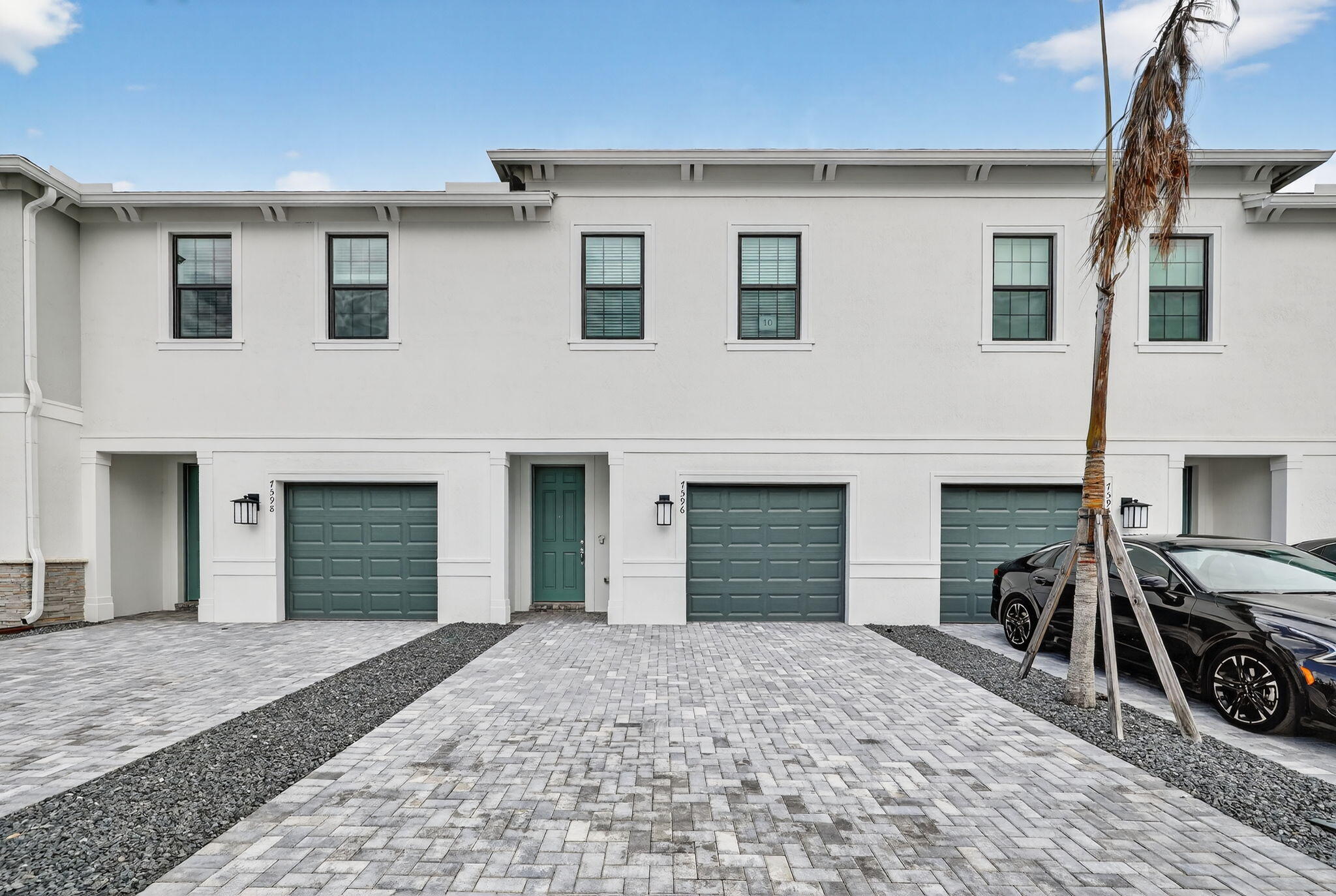 7596 Southwest Linus Lane Stuart, FL 34997 - Photo 2 of 26 a view of a house with windows and a fireplace