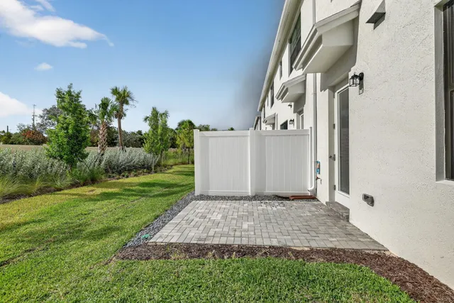 a view of a back yard of the house