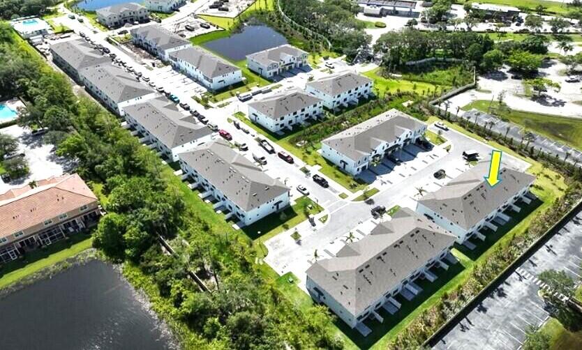 7596 Southwest Linus Lane Stuart, FL 34997 - Photo 23 of 26 an aerial view of a house with a garden and mountain view in back