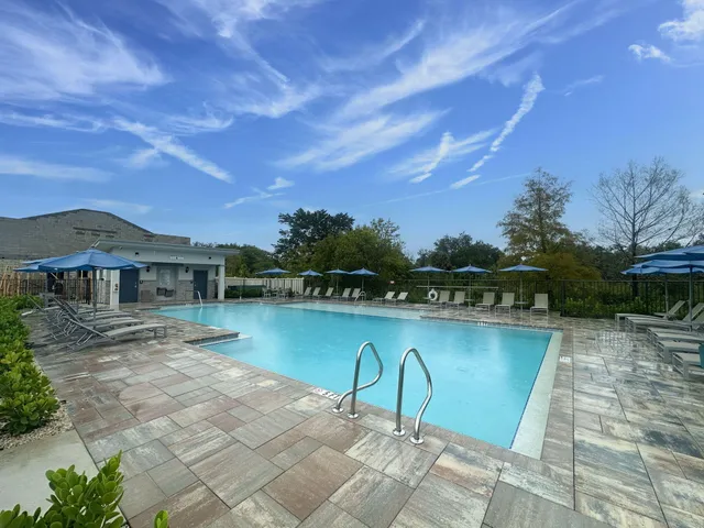 a picture of a bench in front of a wall