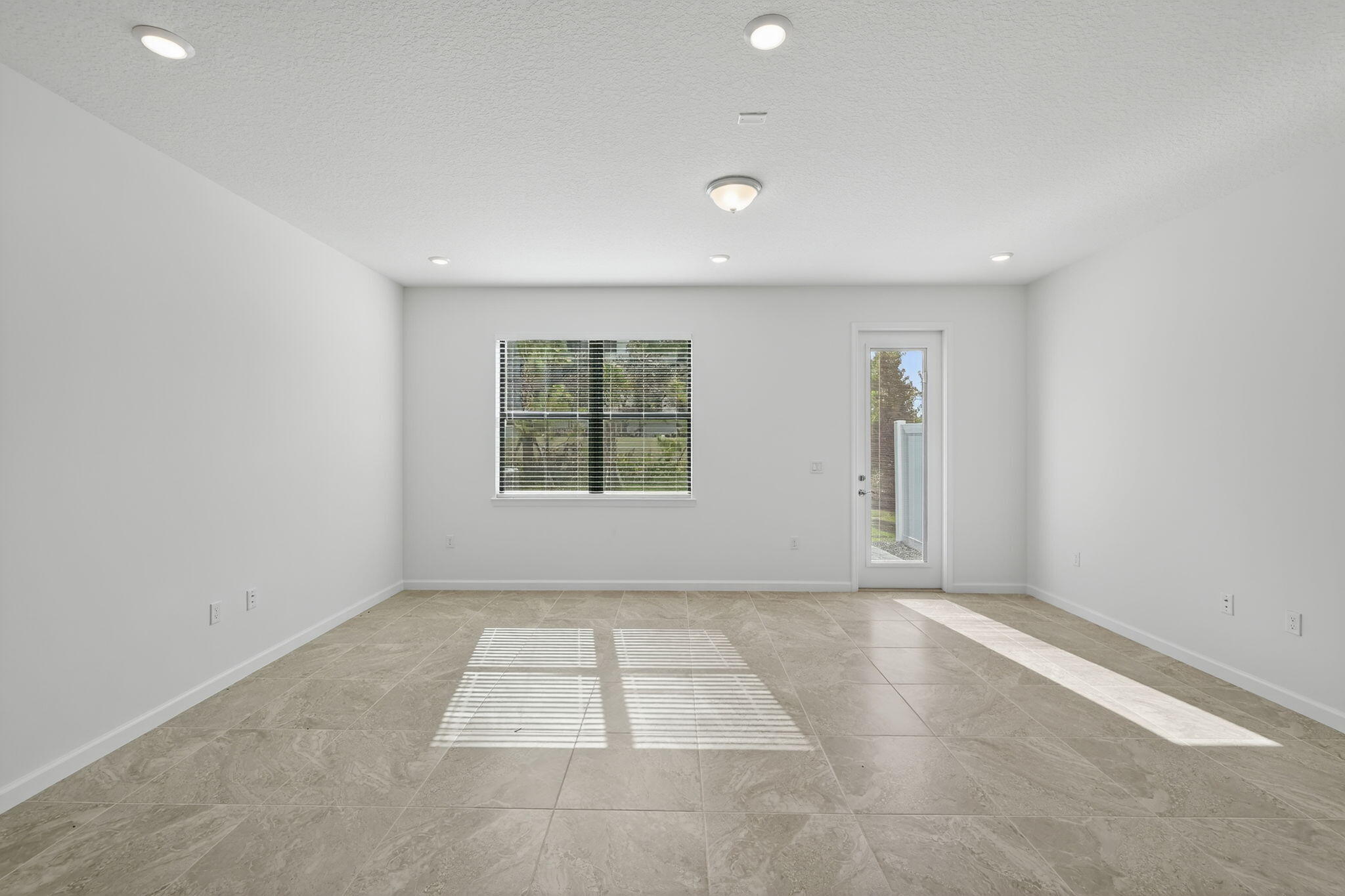 7596 Southwest Linus Lane Stuart, FL 34997 - Photo 6 of 26 an empty room with windows