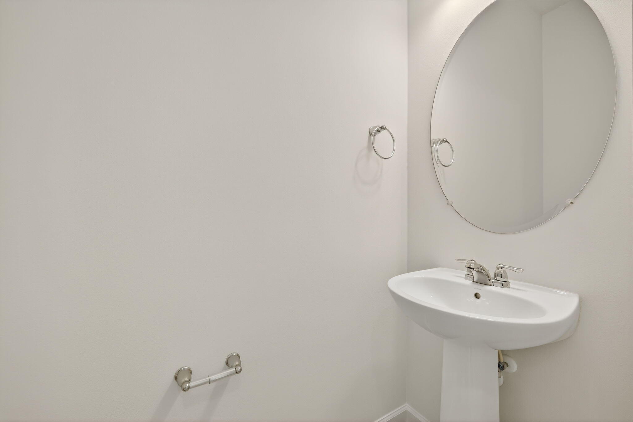 7596 Southwest Linus Lane Stuart, FL 34997 - Photo 9 of 26 a bathroom with a sink and a mirror