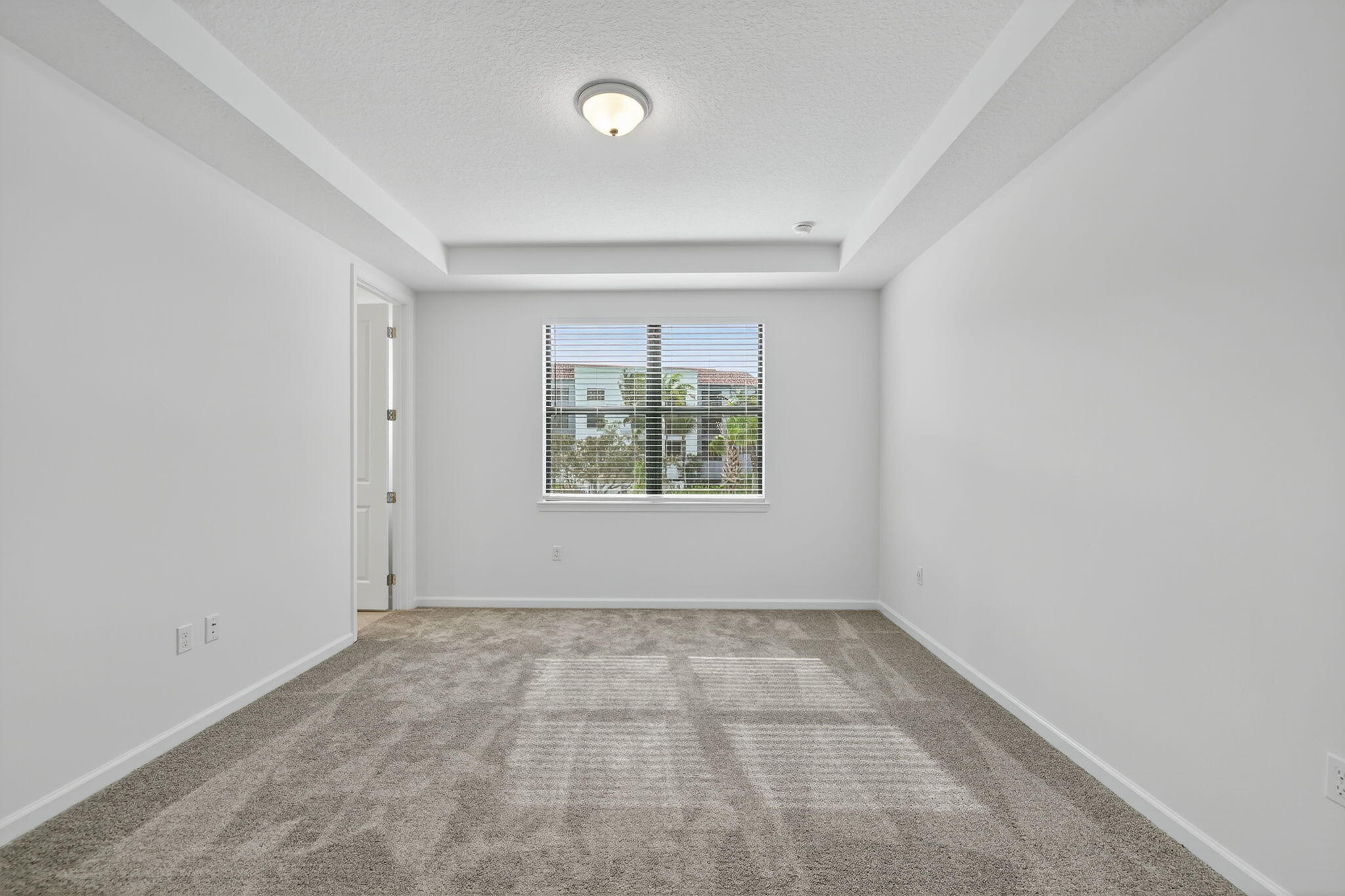7596 Southwest Linus Lane Stuart, FL 34997 - Photo 10 of 26 an empty room with windows