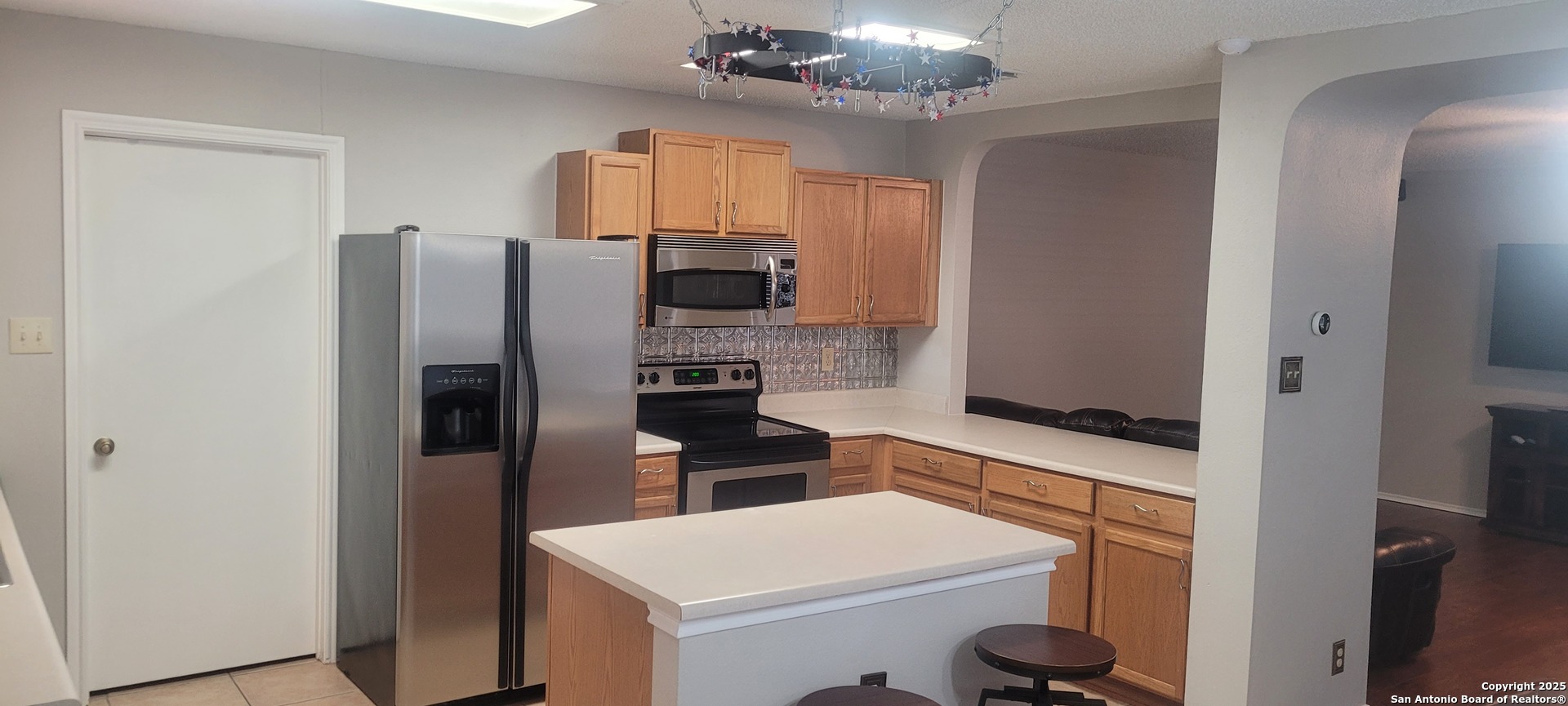 7006 Raintree Place San Antonio, TX 78233 - Photo 14 of 19 a kitchen with stainless steel appliances a refrigerator sink and stove