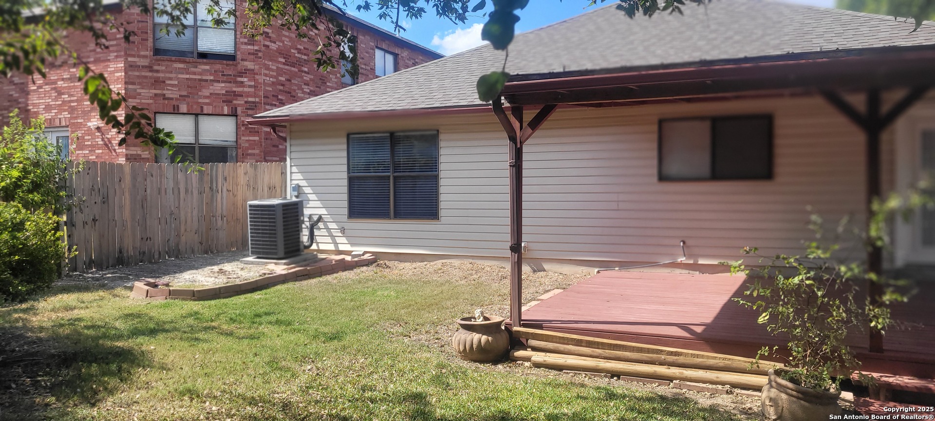 7006 Raintree Place San Antonio, TX 78233 - Photo 15 of 19 a backyard of a house with seating space
