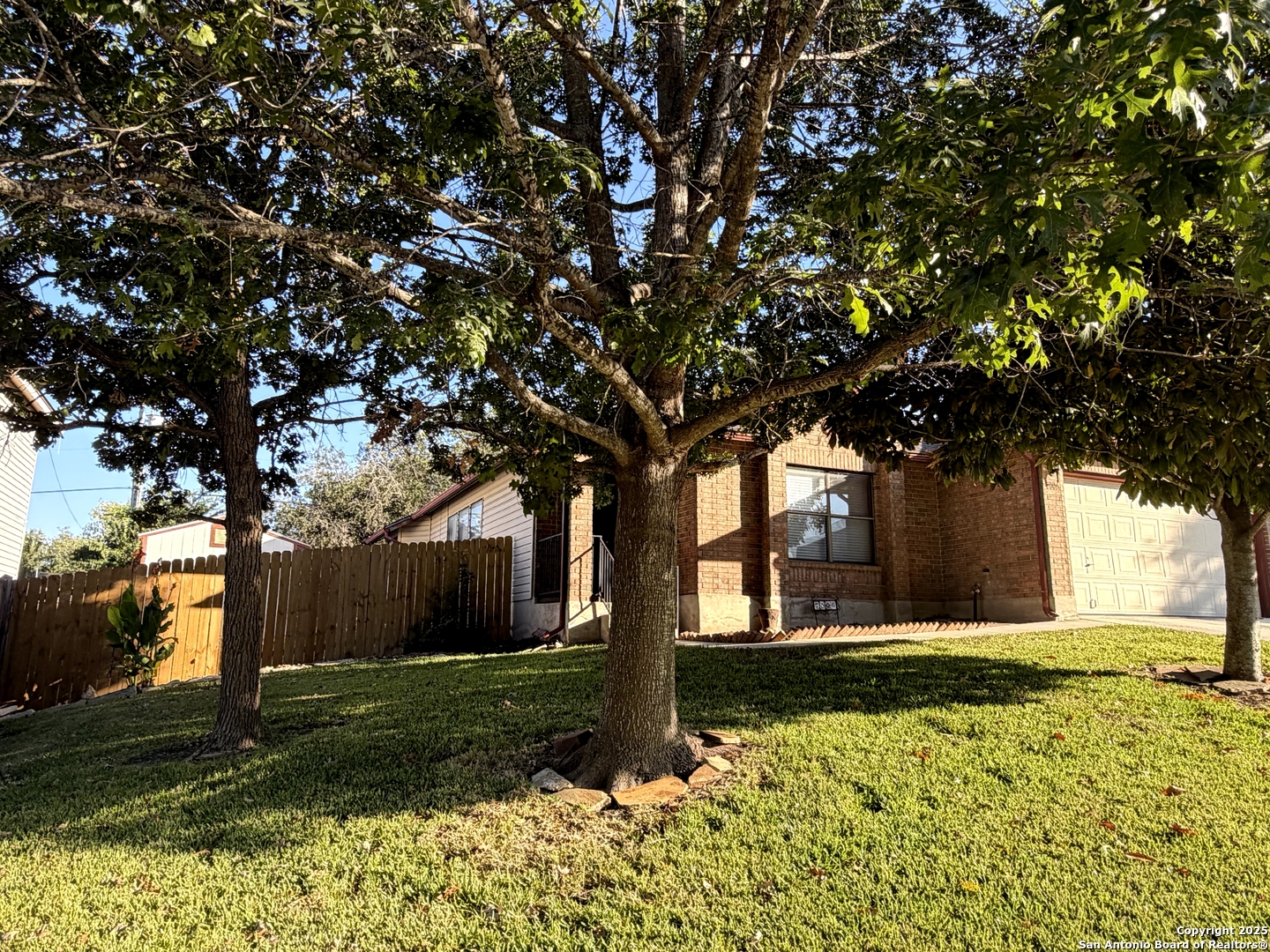 7006 Raintree Place San Antonio, TX 78233 - Photo 19 of 19 a front view of a house with a yard