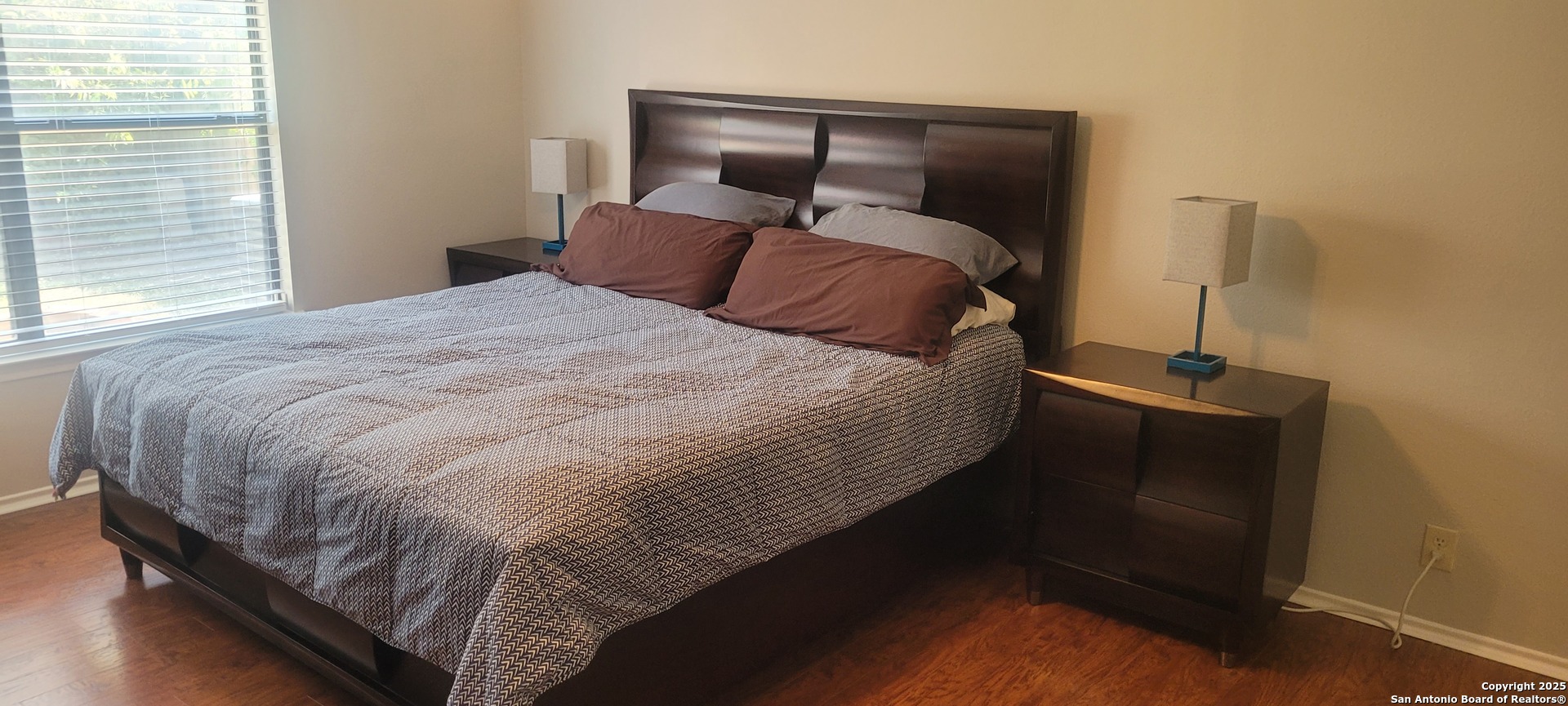 7006 Raintree Place San Antonio, TX 78233 - Photo 6 of 19 a bedroom with a bed and a window