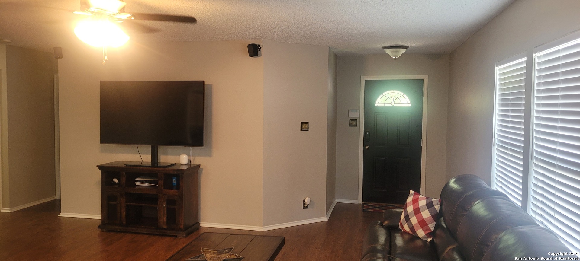 7006 Raintree Place San Antonio, TX 78233 - Photo 9 of 19 a living room with furniture and a flat screen tv