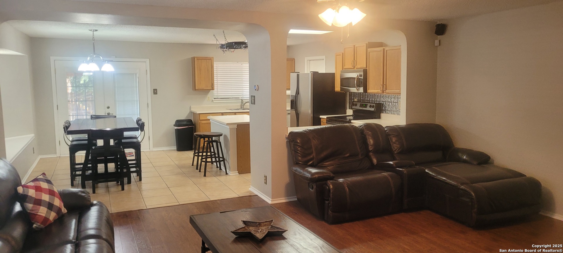 7006 Raintree Place San Antonio, TX 78233 - Photo 10 of 19 a living room with furniture and wooden floor