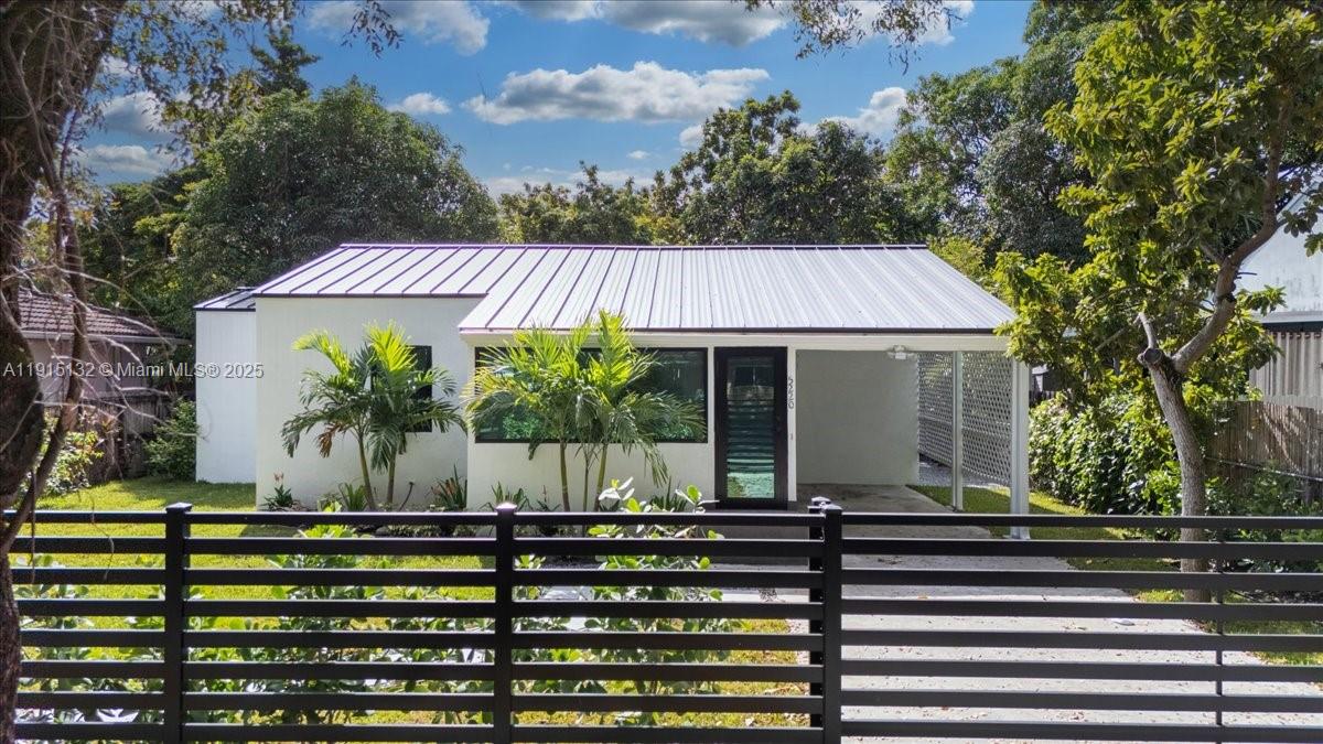 5220 Southwest 6th Street Miami, FL 33134 - Photo 14 of 56 a front view of a house with garden