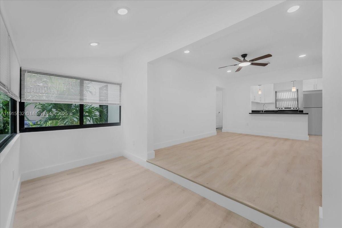5220 Southwest 6th Street Miami, FL 33134 - Photo 19 of 56 wooden floor in an empty room with a window