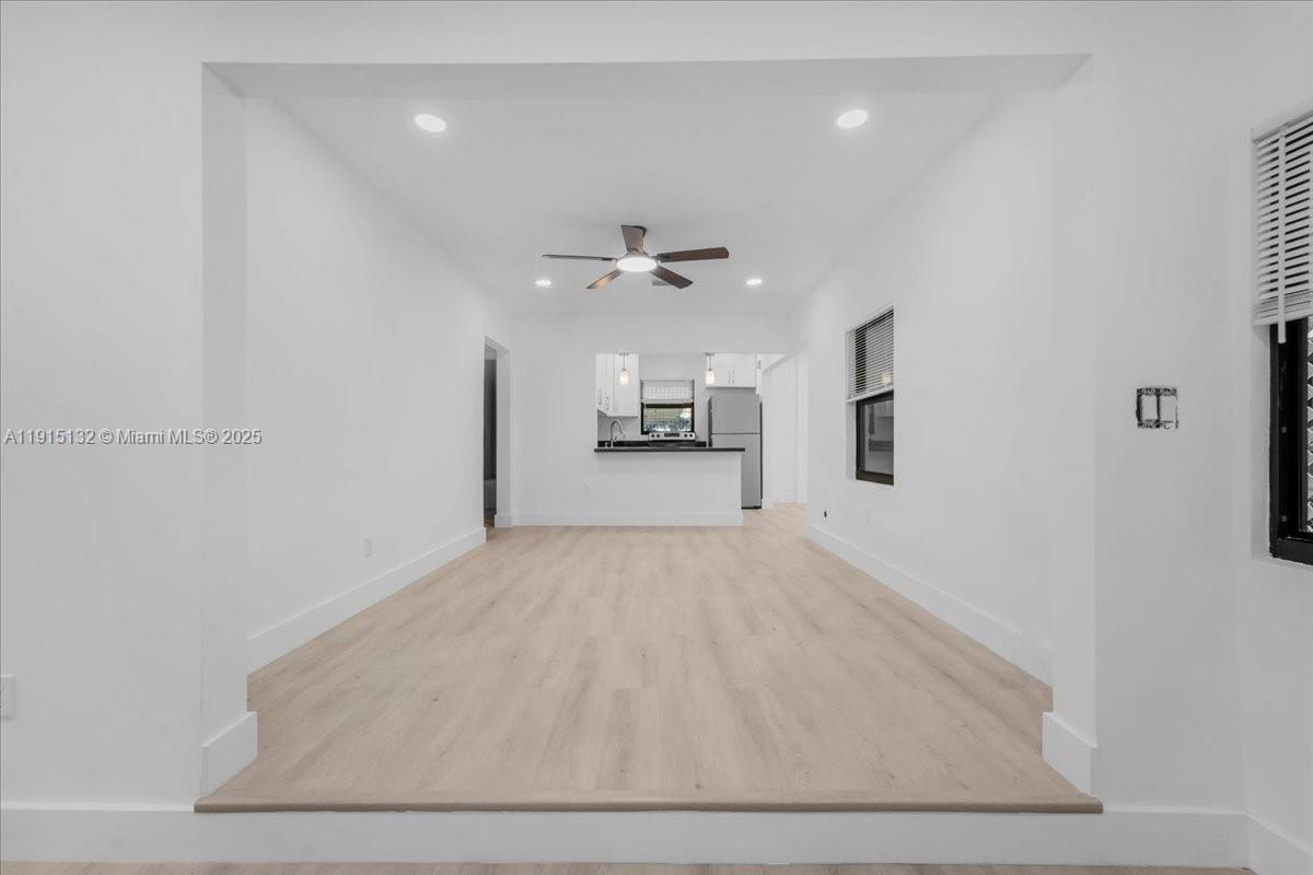 5220 Southwest 6th Street Miami, FL 33134 - Photo 20 of 56 wooden floor in an empty room with a ceiling fan