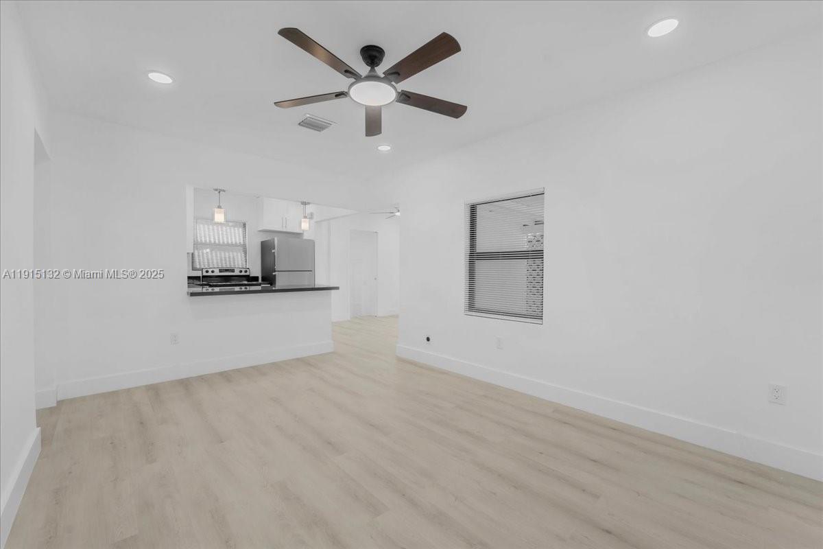 5220 Southwest 6th Street Miami, FL 33134 - Photo 23 of 56 an empty room with a empty space and a ceiling fan