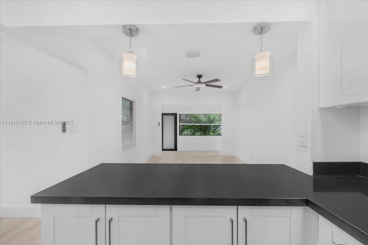 5220 Southwest 6th Street Miami, FL 33134 - Photo 27 of 56 a view of room with a ceiling fan a potted plant and a ceiling fan