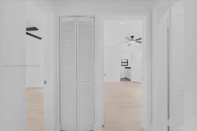 an empty room with fan