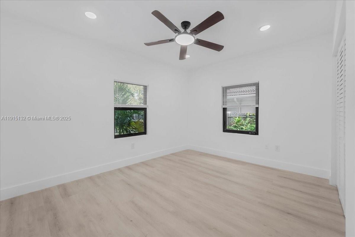 5220 Southwest 6th Street Miami, FL 33134 - Photo 30 of 56 an empty room with window and ceiling fan