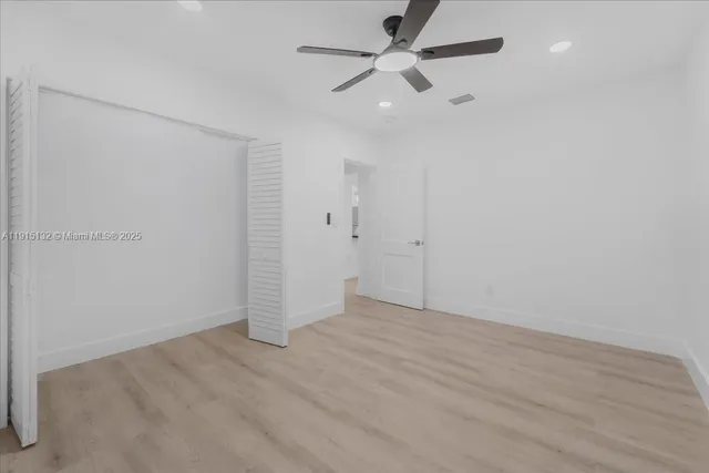 a bathroom with a granite countertop sink toilet and bathtub