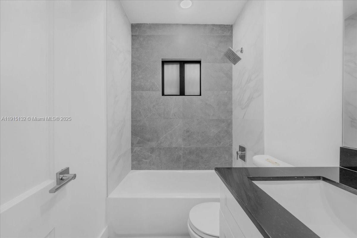 5220 Southwest 6th Street Miami, FL 33134 - Photo 34 of 56 a bathroom with a toilet and a bathtub