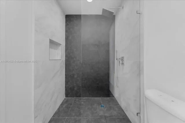 a kitchen with a stove and a refrigerator