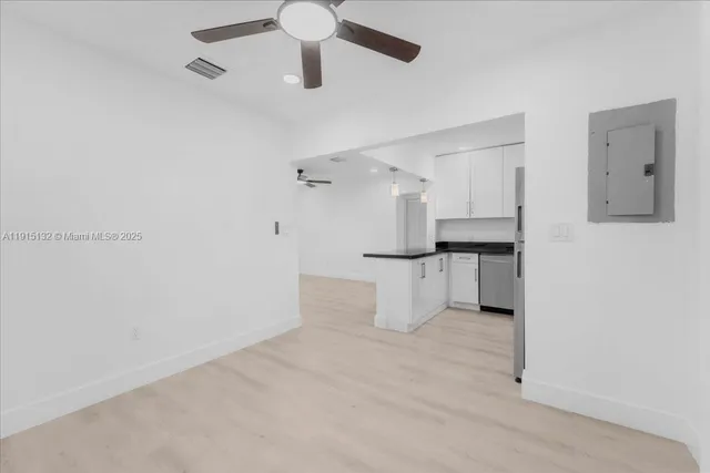 a view of an empty room with a window