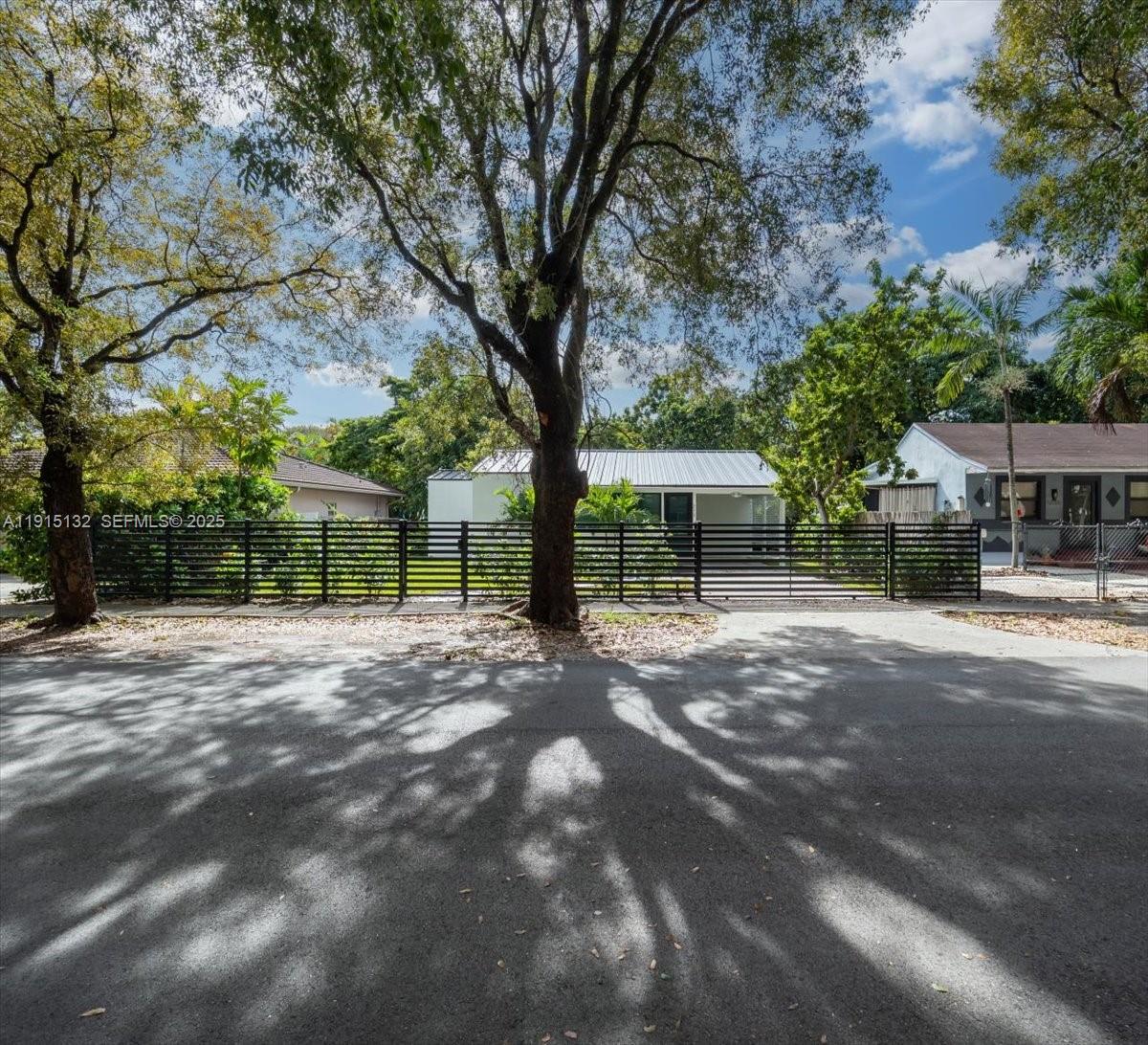 5220 Southwest 6th Street Miami, FL 33134 - Photo 5 of 56 a view of backyard with a garden and trees