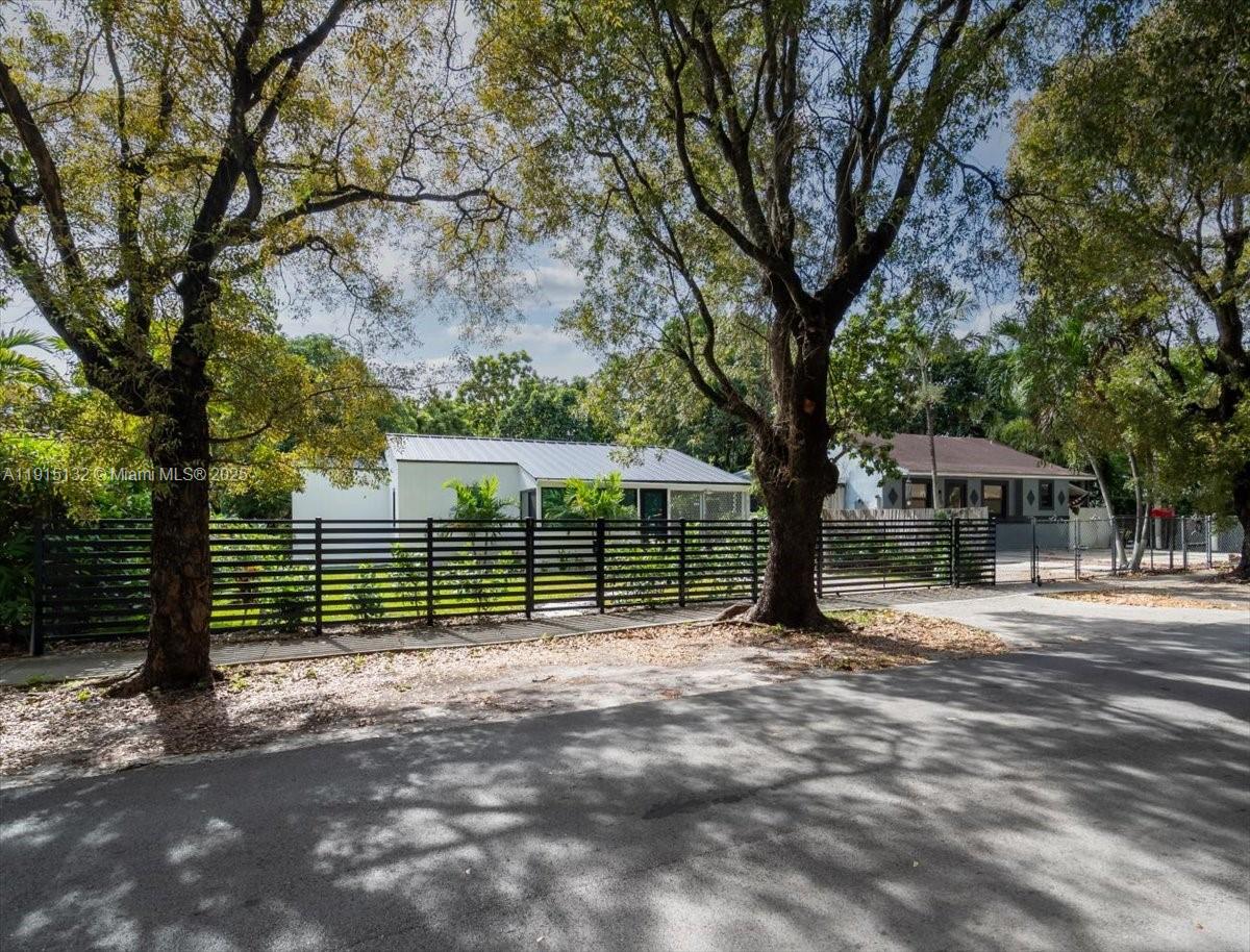 5220 Southwest 6th Street Miami, FL 33134 - Photo 6 of 56 a view of a house with a tree in the yard