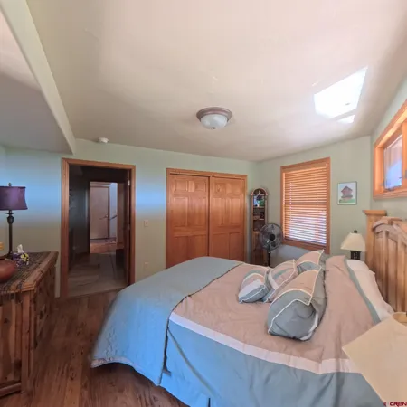 a bed room with a bed and dresser
