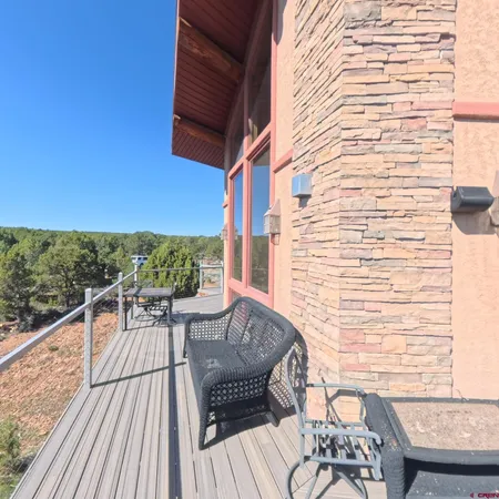 a view of roof deck with patio