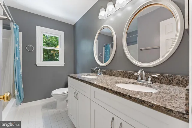 a view of a swimming pool with a table chairs under an umbrella