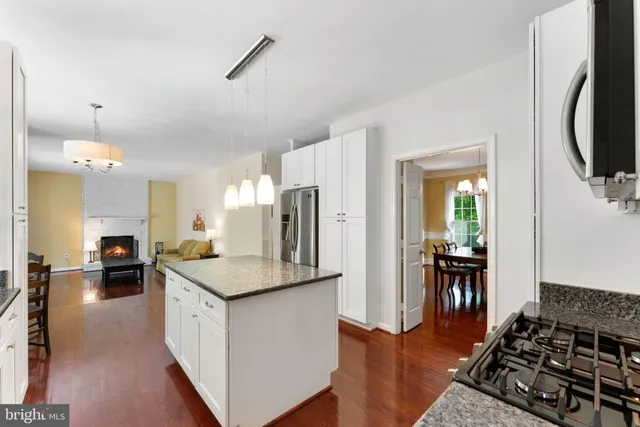 a view of a livingroom with furniture window and wooden floor