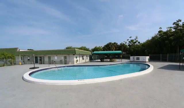 a view of a swimming pool with an outdoor seating